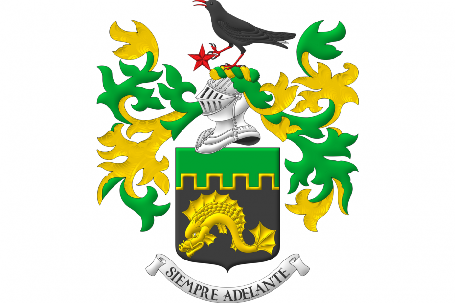Sable, a dolphin naiant Or; a chief embattled Vert, fimbriated Or. Crest: Upon a helm with a wreath Or and Vert, a cornish chough speaking proper, his dexter foot grasping the point of a mullet Gules. Mantling: Vert doubled Or. Motto: «Siempre Adelante».